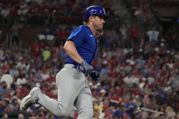 Chicago Cubs' Patrick Wisdom rounds the bases after hitting a solo home run during the fifth inning of a baseball game against the St. Louis Cardinals Friday, July 28, 2023, in St. Louis. (AP Photo/Jeff Roberson)