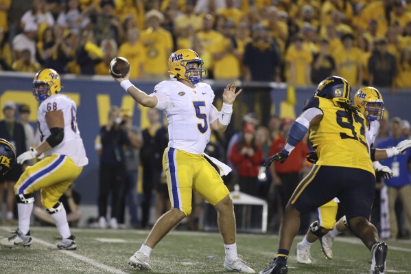 Pittsburgh quarterback Phil Jurkovec (5) attempts a pass during the first half of an NCAA college football game against West Virginia, Saturday, Sept. 16, 2023, in Morgantown, W.Va. (AP Photo/Chris Jackson)