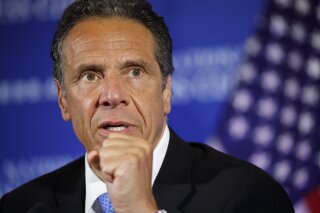 FILE - In this May 27, 2020, file photo, New York Gov. Andrew Cuomo speaks during a news conference at the National Press Club in Washington. New York's governor signed an executive order Wednesday, June 17, recognizing Juneteenth as a paid holiday for state employees to commemorate the emancipation of slaves in the U.S. Cuomo said he will propose legislation next year making June 19 a permanent state holiday. (AP Photo/Jacquelyn Martin, File)