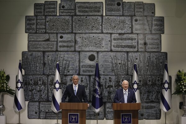 Israeli President Reuven Rivlin, right, and Blue and White Party leader Benny Gantz speak to media after Gantz receive a mandate to form new government to n Jerusalem, Wednesday, Oct. 23, 2019. (AP Photo/Sebastian Scheiner)