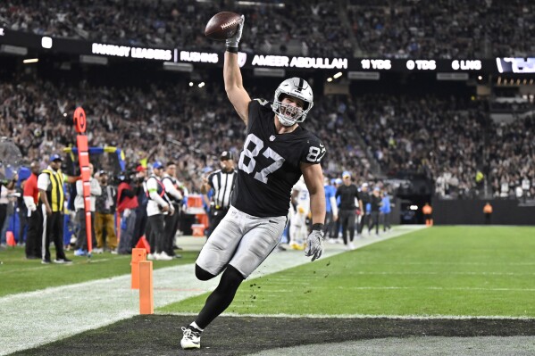 Las Vegas Raiders tight end Michael Mayer (87) celebrates after scoring a touchdown against the Los Angeles Chargers during the first half of an NFL football game, Thursday, Dec. 14, 2023, in Las Vegas. (AP Photo/David Becker)
