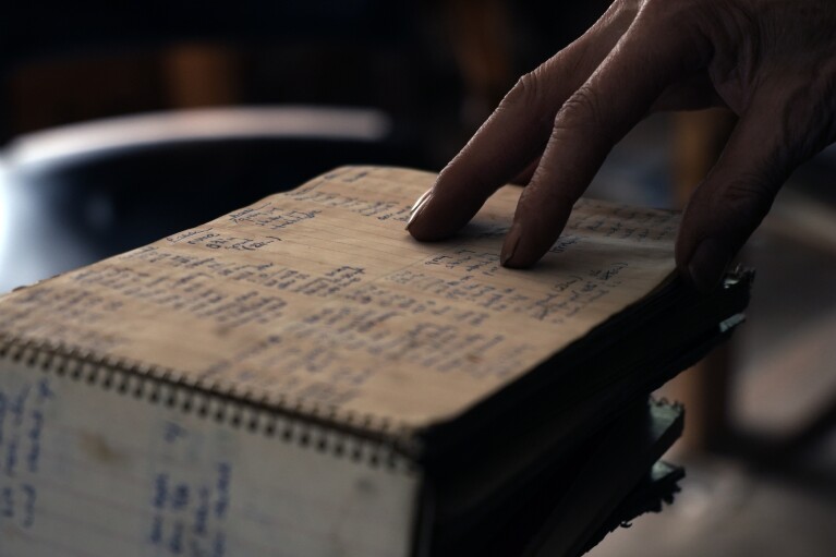 Billy Barr shows nan handwritten notes he kept connected upwind and animal sightings Wednesday, March 13, 2024, successful Gothic, Colo. Today, that information is logged digitally. (AP Photo/Brittany Peterson)