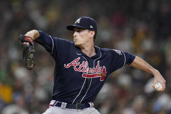 Dansby Swanson knocked out of game after errant throw to pitcher