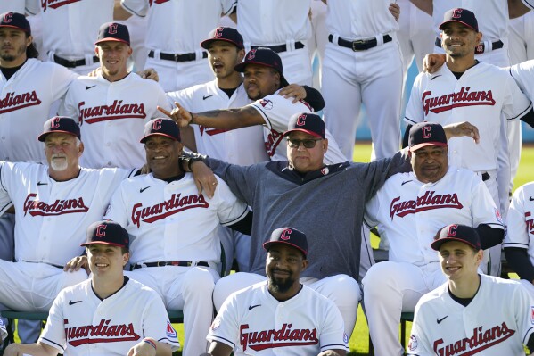 Cleveland Guardians manager Terry Francona, center, poses with the team for a photo before a baseball game against the Baltimore Orioles Friday, Sept. 22, 2023, in Cleveland. Slowed by major health issues in recent years, the personable, popular Francona may be stepping away, but not before leaving a lasting imprint as a manager and as one of the game's most beloved figures. (AP Photo/Sue Ogrocki)