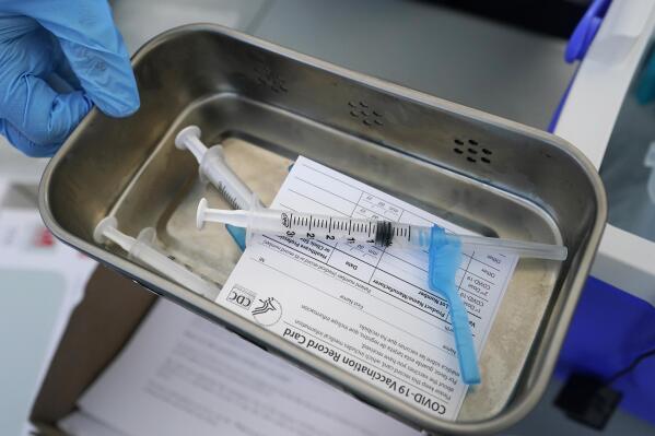 FILE - This May 13, 2021, file photo shows syringes filled with the Johnson & Johnson vaccine at a mobile vaccination site in Miami. Police departments that are requiring officers to be vaccinated against COVID-19 are running up against pockets of resistance across the U.S. (AP Photo/Wilfredo Lee, File)