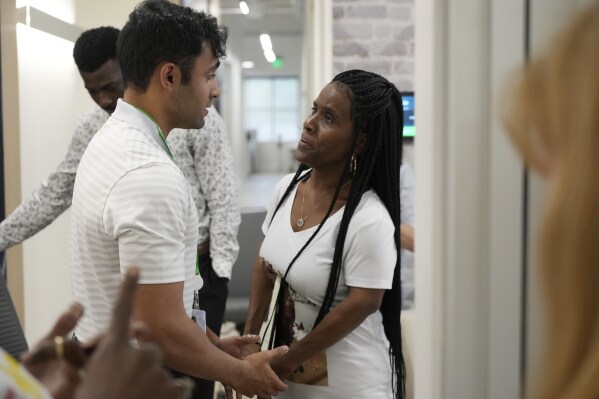 Meharry Medical College student Mikhail Thanawalla talks with Daphne Myers, right, after Myers spoke with a group of Meharry students June 17, 2023, in Nashville, Tenn., about the decision of her late son to be an organ donor before his death at age 26. A donor representative asked Myers all about her son — how Haston Stafford Myers Jr. always helped others and loved to sing. Only then did Myers learn her son was a registered organ donor and realized she supported his choice. (AP Photo/Mark Humphrey)