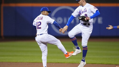 New York Mets' Francisco Lindor (12) and Brandon Nimmo (9) celebrate after a baseball game against the Milwaukee Brewers Tuesday, June 27, 2023, in New York. The Mets won 7-2. (AP Photo/Frank Franklin II)