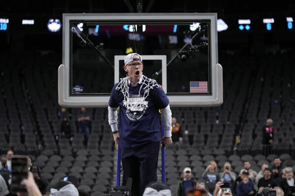 UConn head coach Dan Hurley celebrates after cutting down the netting from the 82-54 win against Gonzaga of an Elite 8 college basketball game in the West Region final of the NCAA Tournament, Saturday, March 25, 2023, in Las Vegas. (AP Photo/John Locher)