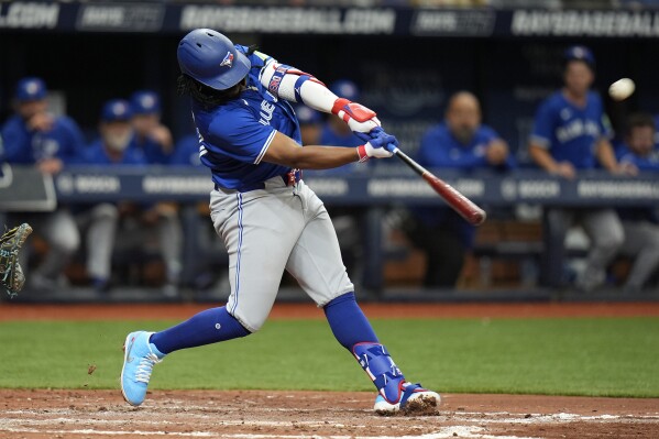 Toronto Blue Jays' Vladimir Guerrero Jr. connecgts for a home run off Tampa Bay Rays starting pitcher Zach Eflin during the sixth inning of a baseball game Thursday, March 28, 2024, in St. Petersburg, Fla. (AP Photo/Chris O'Meara)