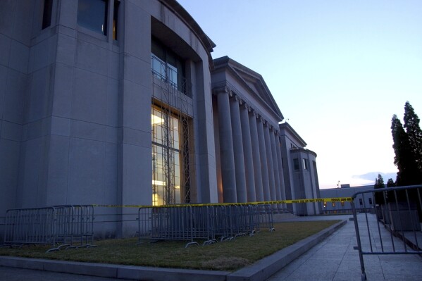 FILE - Police tape and barricades line the plaza of the Alabama Judicial Building in Montgomery, Ala., Wednesday, Sept. 3, 2003. he Alabama Supreme Court has ruled Friday, Feb. 16, 2024, that frozen embryos can be considered children under state law, a ruling critics said could have sweeping implications for fertility treatments. (APPhoto/Dave Martin, File)