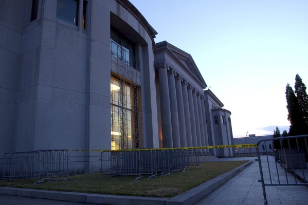 FILE - Police tape and barricades line the plaza of the Alabama Judicial Building in Montgomery, Ala., Wednesday, Sept. 3, 2003. he Alabama Supreme Court has ruled Friday, Feb. 16, 2024, that frozen embryos can be considered children under state law, a ruling critics said could have sweeping implications for fertility treatments. (AP Photo/Dave Martin, File)