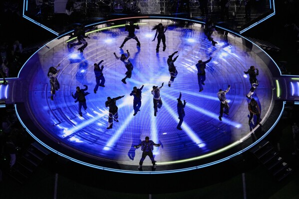 Usher, bottom center, performs during halftime of the NFL Super Bowl 58 football game between the San Francisco 49ers and the Kansas City Chiefs Sunday, Feb. 11, 2024, in Las Vegas. (AP Photo/David J. Phillip)