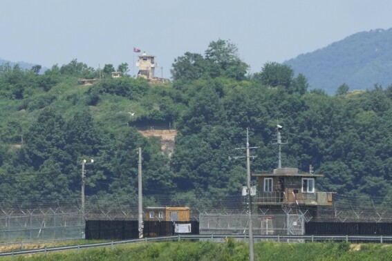 A North Korean military guard post, top, and South Korean post, bottom, are seen from Paju, South Korea, near the border with North Korea, Friday, May 31, 2024. North Korean leader Kim Jong Un supervised firing drills involving nuclear-capable, multiple rocket launchers to show the country's ability to carry out preemptive attacks on rival South Korea, state media reported Friday. (AP Photo/Ahn Young-joon)