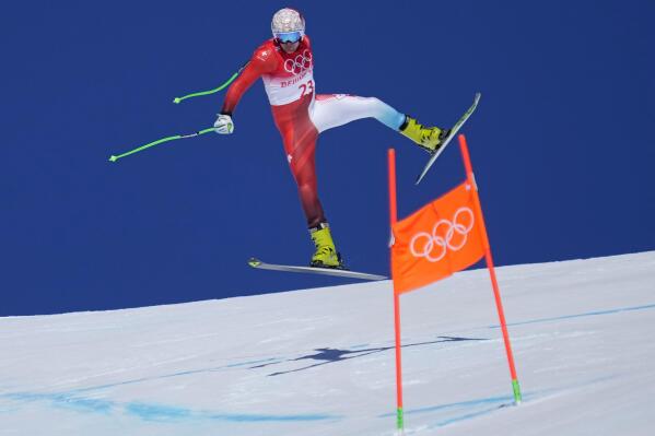 Stefan Rogentin, of Switzerland makes a jump during a men's downhill training run at the 2022 Winter Olympics, Thursday, Feb. 3, 2022, in the Yanqing district of Beijing. (AP Photo/Robert F. Bukaty)