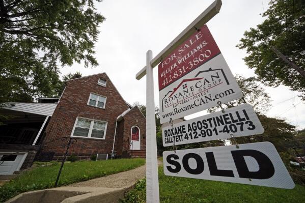 This is a home sold in Mount Lebanon, Pa., on Tuesday, Sept. 21, 2021. Sales of previously occupied homes fell in December for the first time in four months as mortgage rates ticked higher and would-be buyers struggled to find properties with the number of properties on the market at record-lows.  (AP Photo/Gene J. Puskar)