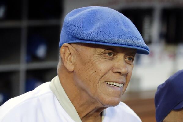 FILE - Former Los Angeles Dodgers shortstop Maury Wills is shown before Game 2 of baseball's NL Division Series between the Dodgers and the St. Louis Cardinals in Los Angeles, Saturday, Oct. 4, 2014. Maury Wills, who helped the Los Angeles Dodgers win three World Series titles with his base-stealing prowess, has died. The team says Wills died Monday night, Sept. 19, 2022, in Sedona, Ariz. He was 89. (AP Photo/Jae C. Hong, File)