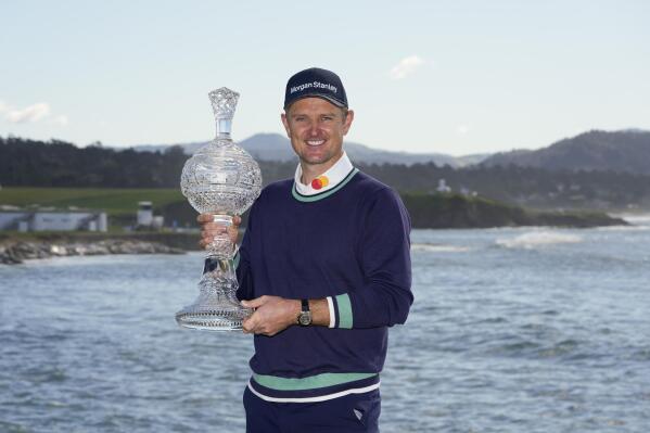 Justin Rose, of England, poses for a photograph with the trophy after winning the AT&T Pebble Beach Pro-Am golf tournament in Pebble Beach, Calif., Monday, Feb. 6, 2023. (AP Photo/Godofredo A. Vásquez)