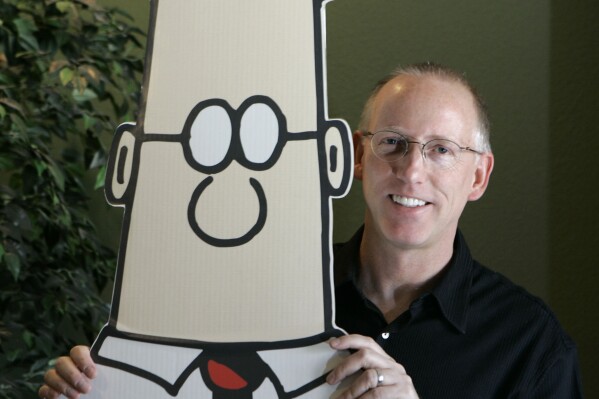 FLE - Scott Adams, creator of the comic strip Dilbert, poses for a portrait with the Dilbert character in his studio in Dublin, Calif., Oct. 26, 2006. (AP Photo/Marcio Jose Sanchez, File)