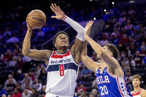Washington Wizards forward Rui Hachimura (8) eyes the basket as Philadelphia 76ers forward Georges Niang (20) defends during the first half on an NBA basketball game Wednesday, Nov. 2, 2022, in Philadelphia. (AP Photo/Laurence Kesterson)