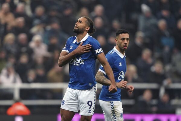 Everton's Dominic Calvert-Lewin celebrates scoring their side's first goal during the English Premier League soccer match between Newcastle United and Everton at St. James' Park, in Newcastle, England, Tuesday, April 2, 2024. (Owen Humphreys/PA via AP)