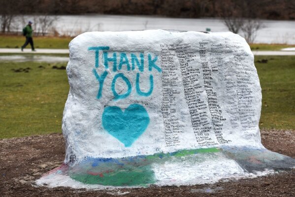 
              This Thursday, Jan. 25, 2018 photo shows The Rock on Michigan State University's campus which was painted  "Thank You" and and includes the names of the women who gave victim impact statements during the Larry Nassar sentencing hearing in East Lansing, Mich. Nassar is on his way to prison for the rest of his life for molesting scores of young female athletes, but the scandal is far from over at Michigan State University as victims, lawmakers and a judge demand to know why he wasn't stopped years ago.  (Nick King/Lansing State Journal via AP)
            