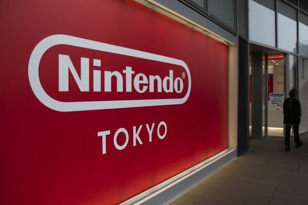 FILE - A Nintendo sign is seen outside Nintendo's official store in the Shibuya district of Tokyo, Thursday, Jan. 23, 2020. Nintendo reported an 18% rise in net profit for the first fiscal half on Tuesday, Nov. 7, 2023, as sales continued to get a boost from its hit Super Mario movie, as well as the popularity of various new video game software.(AP Photo/Jae C. Hong)