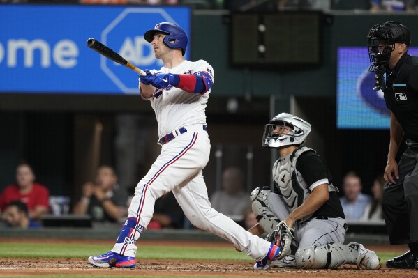 Heaney strikes out 11, Garver and Garcia homer as Rangers beat