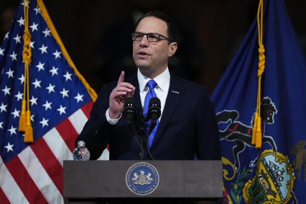 Gov. Josh Shapiro delivers his budget address for the 2024-25 fiscal year to a joint session of the Pennsylvania House and Senate in the Rotunda of the state Capitol in Harrisburg, Pa., Wednesday, Feb. 6, 2024. (AP Photo/Matt Rourke)
