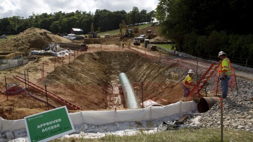 FILE - Construction crews are boring beneath U.S. 221 in Roanoke County, Va., to make a tunnel through which the Mountain Valley Pipeline will pass under the highway, seen on Friday, June 22, 2018. A federal appeals court Monday, July 10, 2023, has again blocked construction on a segment of a contentious natural gas pipeline being built through Virginia and West Virginia, this time doing so even after Congress ordered the project's approval. (Heather Rousseau/The Roanoke Times via AP, File)
