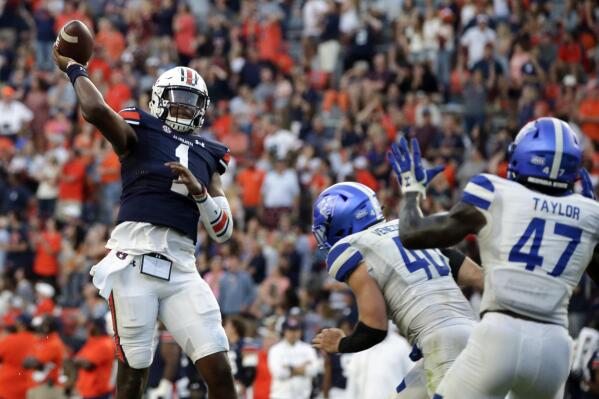 Auburn quarterback TJ Finley (1) throws a pass for a touchdown to take the lead over Georgia State in  the final minute of the second half of an NCAA football game Saturday, Sept. 25, 2021, in Auburn, Ala. (AP Photo/Butch Dill)