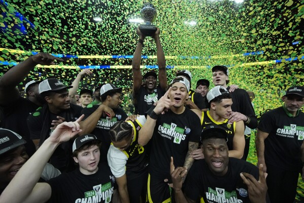 Oregon players celebrate after defeating Colorado in an NCAA college basketball game in the championship of the Pac-12 tournament Saturday, March 16, 2024, in Las Vegas. (AP Photo/John Locher)