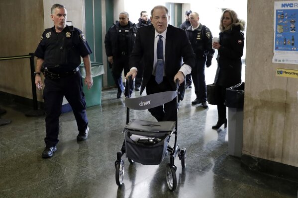 Harvey Weinstein arrives at a Manhattan court as jury deliberations continue in his rape trial, Friday, Feb. 21, 2020 in New York. (AP Photo/Richard Drew)