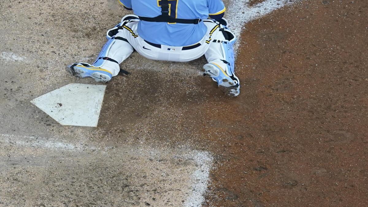 Tag at home plate caps Brewers' 4-3 victory over Pirates