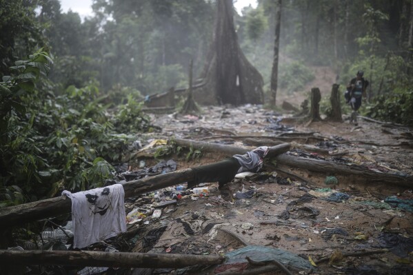 Clothes and garbage are strewn along the path where migrants are trekking across the Darien Gap from Colombia to Panama in hopes of eventually reaching the United States on May 10, 2023.  (AP Photo/Ivan Valencia, File)
