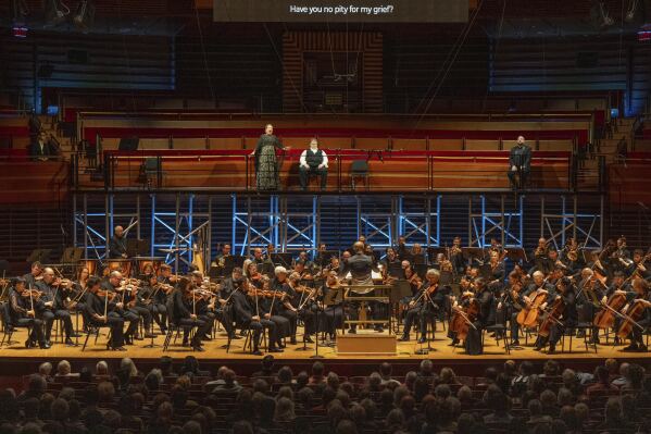 This image released by the Philadelphia Opera shows Soprano Nina Stemme, from top left, tenor Stuart Skelton, and baritone Brian Mulligan, with the Philadelphia Orchestra led by music director Yannick Nézet-Séguin, foreground center, during a concert performance of Wagner’s “Tristan und Isolde” at Marian Anderson Hall in Philadelphia on June 1, 2025. (Jessica Griffin/Philadelphia Opera via AP)