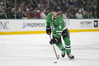 Dallas Stars defenseman Miro Heiskanen skates with the puck against the Vegas Golden Knights during the first period of an NHL game Friday, Jan. 24, 2025, in Dallas. (AP Photo/Julio Cortez)