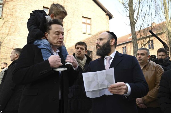 Tesla and SpaceX's CEO Elon Musk visits the site of the Auschwitz-Birkenau Nazi German death camp in Oswiecim, Poland, on Monday, Jan. 22, 2024. Elon Musk visited the site of the Auschwitz-Birkenau World War II Nazi German death camp on Monday, after the billionaire faced criticism for subscribing to an antisemitic conspiracy theory and allowing hate messages on his social media platform, X, formerly known as Twitter. (EJA/Yoav Dudkevitch via AP)