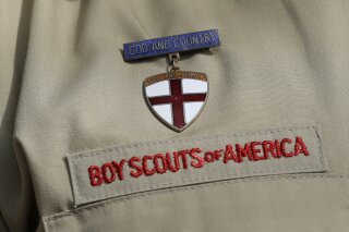 
              FILE - This Feb. 4, 2013 file photo shows a meal pin on a Boy Scout's uniform in Irving, Texas. Under pressure over its past problems with child sex-abuse, the Boy Scouts of America defended its current prevention policies on Wednesday, April 24, 2019 and said there were only five known victims in 2018 of out roughly 2.2 million youth members. (AP Photo/Tony Gutierrez, File)
            
