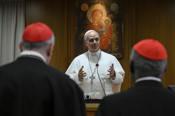 Pope Leo XIV meets the College of Cardinals in the New Synod Hall at the Vatican, Saturday, May 10, 2025. (Vatican Media via AP)