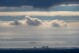A plane descends into Los Angeles International Airport as low clouds gather over the Pacific ahead of forecasted rain in Los Angeles, Sunday, Feb. 18, 2024. (APPhoto/Damian Dovarganes)
