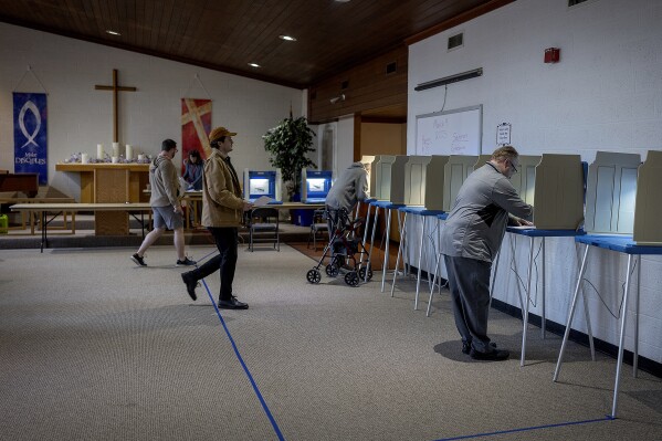 Voters cast their ballots at Advent Lutheran Church in Roseville, Minn., Tuesday, March 11, 2025. (Elizabeth Flores/Star Tribune via AP)