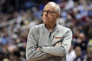 FILE - Syracuse head coach Jim Boeheim watches during their loss against Wake Forest in an NCAA college basketball game at the Atlantic Coast Conference Tournament, March 8, 2023, in Greensboro, N.C. The family of a man who was fatally struck by a vehicle driven by Boeheim in 2019 has agreed to settle a lawsuit against him and Syracuse University, according to court documents. (AP Photo/Chris Carlson, File)