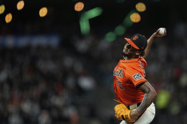 San Francisco Giants pitcher Camilo Doval throws to a Pittsburgh Pirates batter during the ninth inning of a baseball game Friday, April 26, 2024, in San Francisco. (AP Photo/Godofredo A. Vásquez)