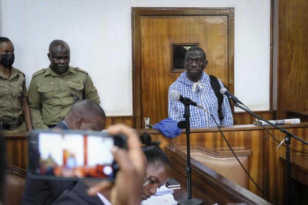 Ugandan opposition leader and four-time presidential candidate Kizza Besigye appears at the Buganda Road Chief Magistrate's court in Kampala, Uganda Wednesday, May 25, 2022. Besigye was criminally charged Wednesday by authorities who accused him of inciting violence with his efforts to stage street protests against rising commodity prices that the government largely blames on the war in Ukraine. (AP Photo/Hajarah Nalwadda)