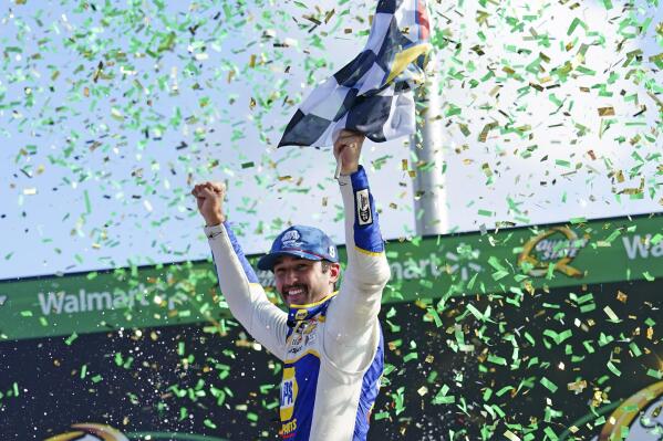 Chase Elliott (9) reacts in Victory Lane after winning the NASCAR Cup Series auto race at Atlanta Motor Speedway, Sunday, July 10, 2022, in Hampton, Ga. (AP Photo/John Bazemore)