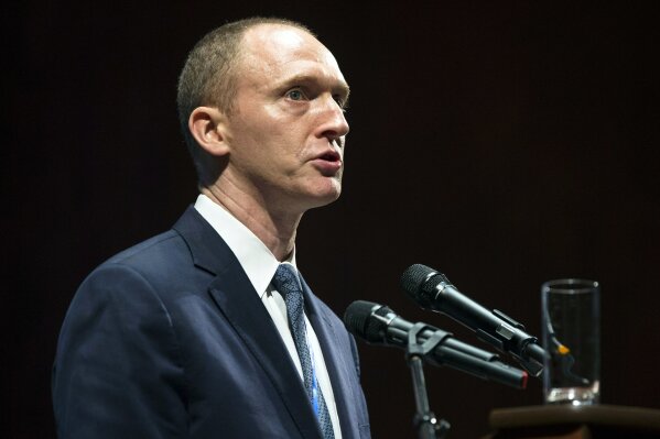 
              FILE - In this Friday, July 8, 2016, file photo, Carter Page, then adviser to U.S. Republican presidential candidate Donald Trump, speaks at the graduation ceremony for the New Economic School in Moscow, Russia. A foreign policy adviser to Donald Trump’s presidential campaign met with a Russian intelligence operative in 2013 and provided him documents about the energy industry, according to court filings. The Russian, Victor Podobnyy, was one of three men charged in connection with a Cold War-style Russian spy ring. According to the court documents, Podobnyy tried to recruit Page, an energy consultant working in New York at the time, as an intelligence source. Page is referred to in the filing as “Male-1.” (AP Photo/Pavel Golovkin, File)
            