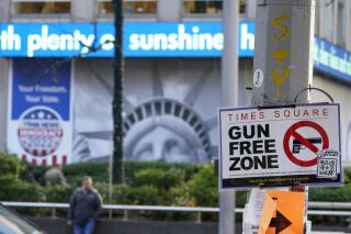 A sign on the corner of 48th Street and 6th Avenue announces Times Square as a gun free zone, Tuesday, Oct. 11, 2022, in New York. The Associated Press on Wednesday, March 29, 2023 reported on misleading social media posts claiming more than 90% of all mass shootings have happened in so-called “gun-free zones.” (AP Photo/Mary Altaffer)