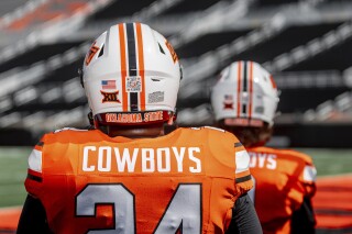 This photo provided by Oklahoma State Athletics shows a QR code on an Oklahoma State NCAA college football helmet, Thursday, Aug. 15, 2024, at Boone Pickens Stadium in Stillwater, Okla. (Bruce Waterfield/OSU Athletics via AP)