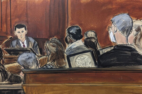 In this courtroom sketch, Sam Bankman-Fried testifies on the witness stand in Manhattan federal court, Friday, Oct. 27, 2023, in New York. (Elizabeth Williams via AP)