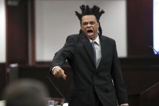 Ronnie Oneal III gives his opening statement during his murder trial at the George Edgecomb Courthouse Monday, June 14, 2021, in Tampa, Fla. Oneal is accused of two counts of first-degree murder in the killings of his girlfriend Kenyatta Barron and their 9-year-old daughter, Ron'Niveya Oneal. He is also accused of attempting to kill his then-8-year-old son. (Arielle Bader/Tampa Bay Times via AP)